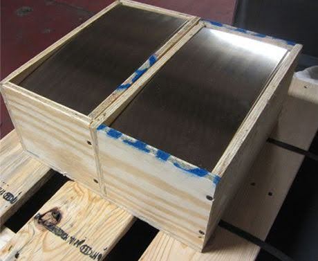 C73500 nickel silver sheet stock packed in wooden crates on a warehouse pallet.